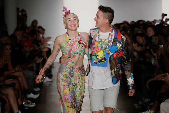 Miley Cyrus, in her questionable outfit, on the catwalk with  Jeremy Scott 