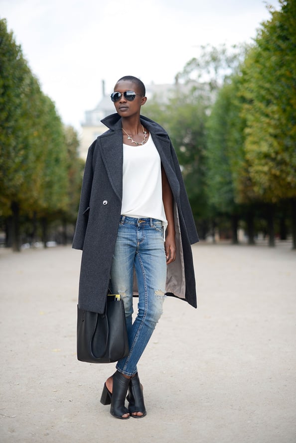 Aliane Uwimana takes simple high street to the next level wearing H&M coat, Zara shirt and pants, New Look shoes and Pull and Bear bag.