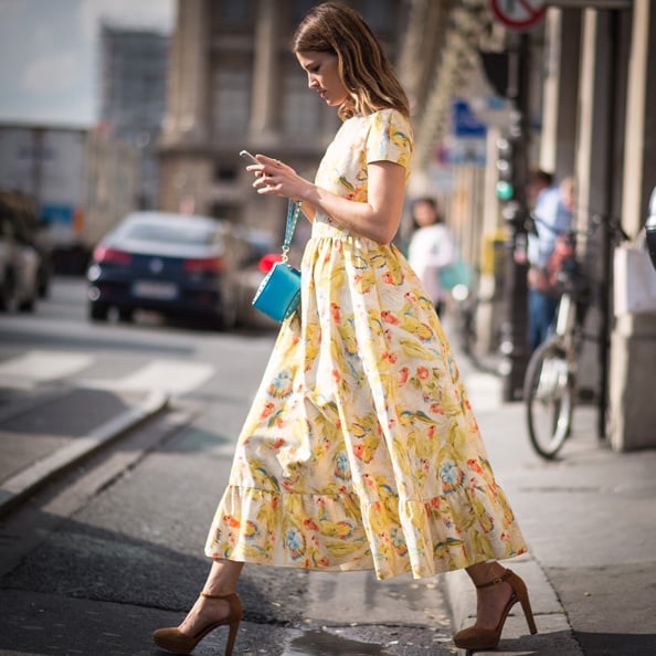 Hanneli Mustaparta makes the most of the sunshine in a print dress.