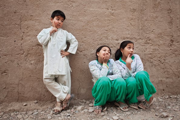 Mehran, a seven-year-old bacha posh, poses with her sisters