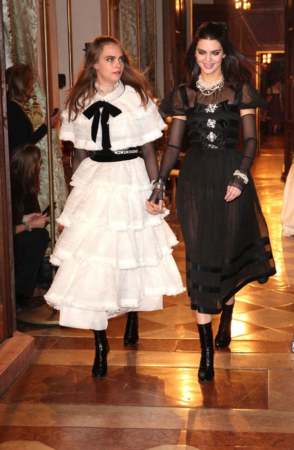 Model Cara Delevigne and Kendall Jenner during the Chanel Metiers dArt Collection