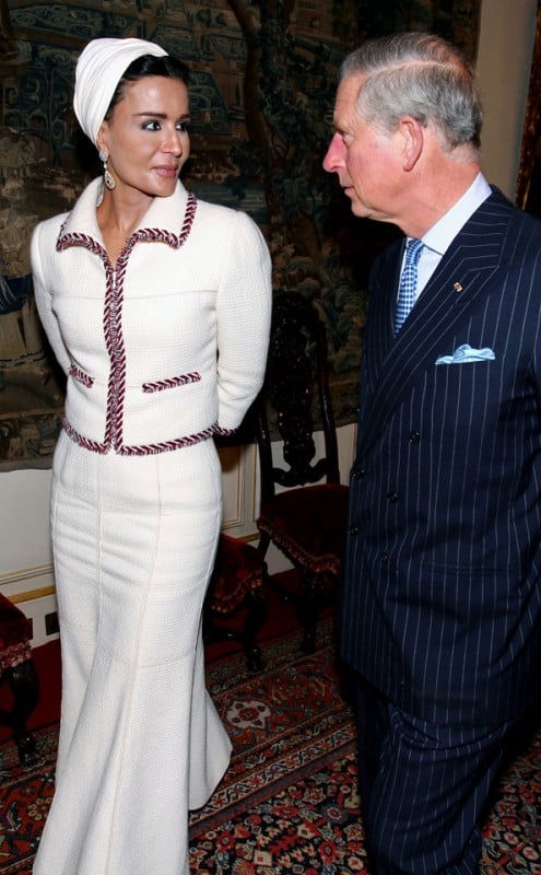 Sheikha Mozah during an official visit to Clarence House in central London. She wears a Chanel couture and accessories from Bucellati that included her earrings and bracelet.