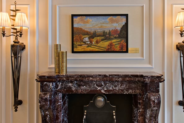 The painting above this fireplace is of Churchill's home in Kent, UK – The Chartwell