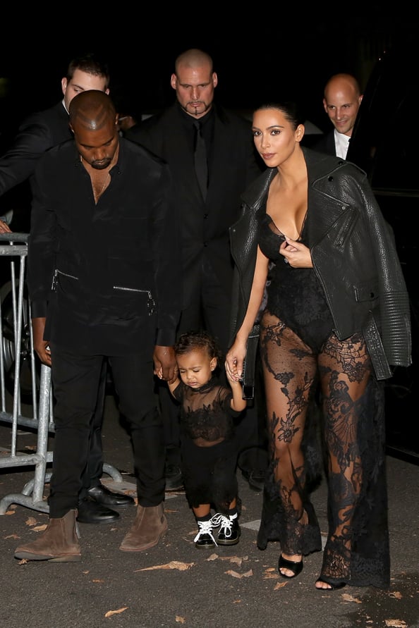 Kanye West. North West, Kim Kardashian with baby North and husband Kanye West at Paris Fashion Week